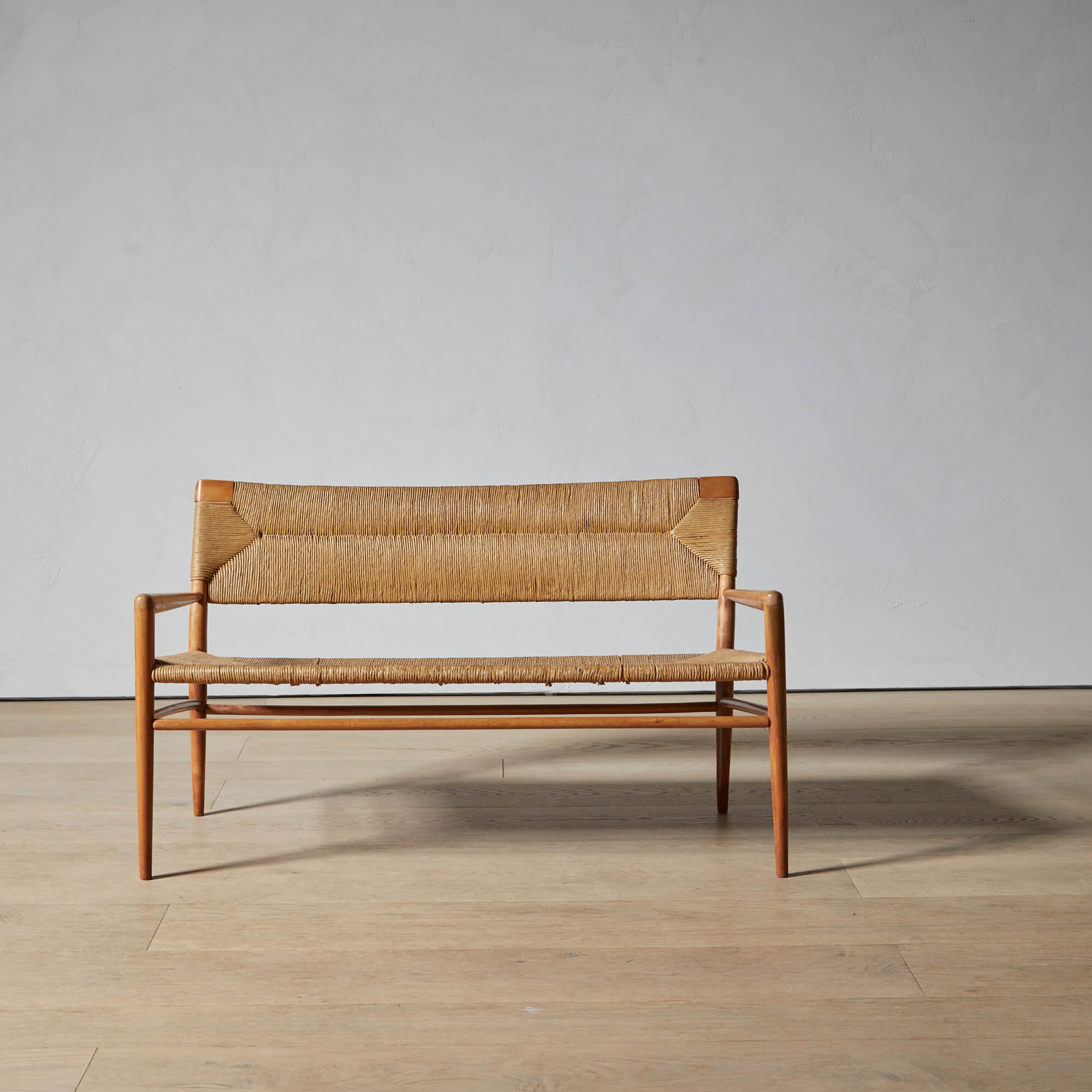 Mel Smilow Bench with woven rush seat and back